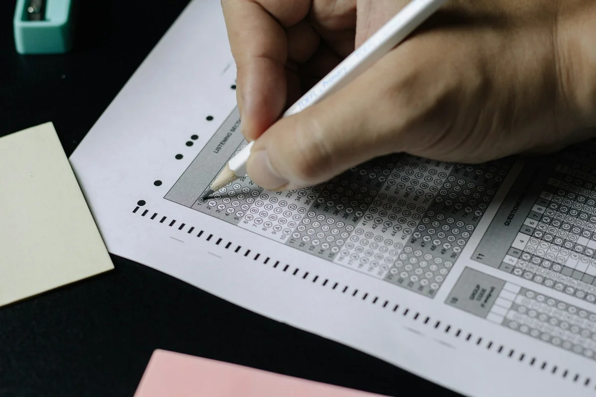 Filling in a multiple-choice G1 knowledge test answer sheet